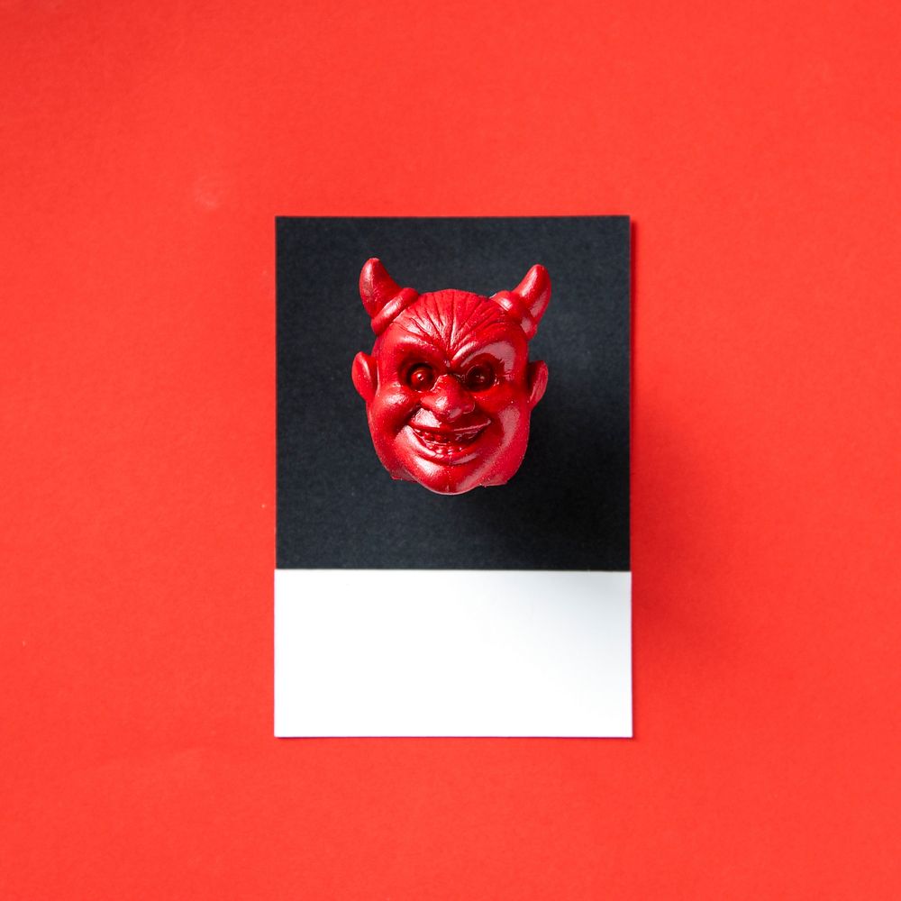 Red horned evil face head