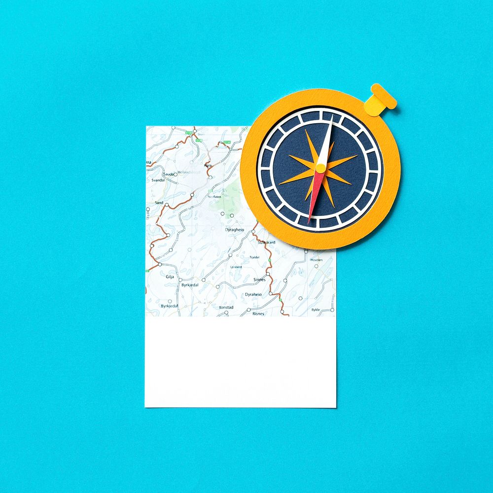 Paper craft art of a map and compass