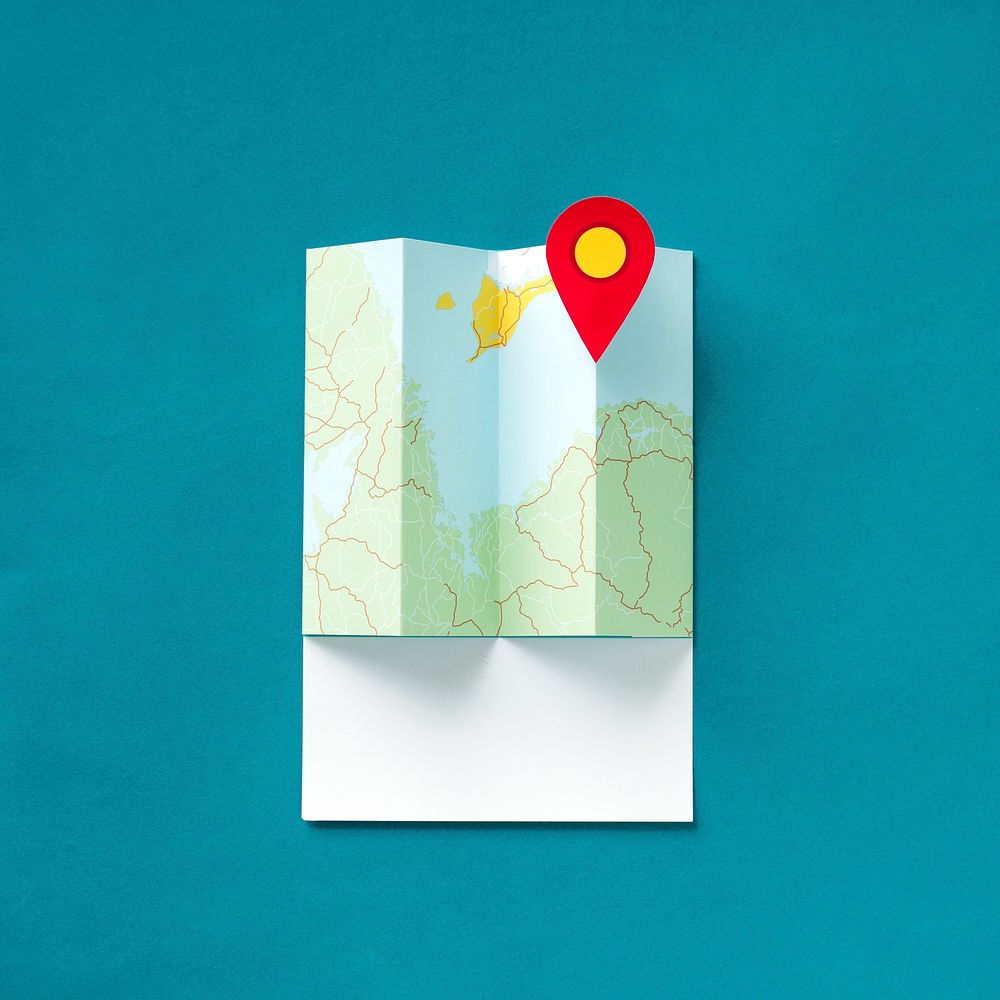Paper craft art of a map with a pointer