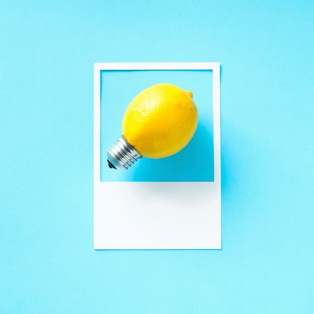 A lemon light bulb in a frame