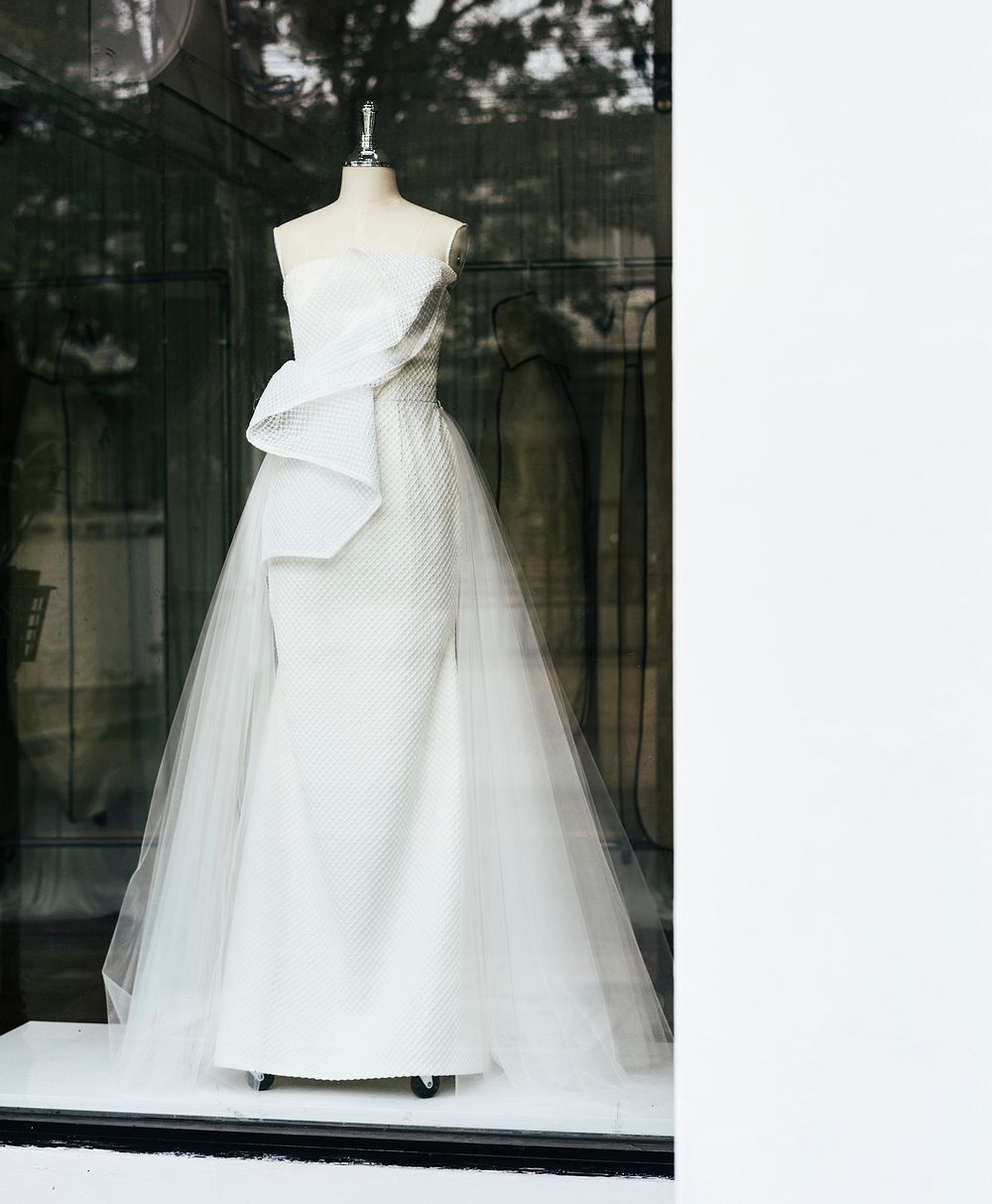 Mannequin wearing a white wedding dress on a display