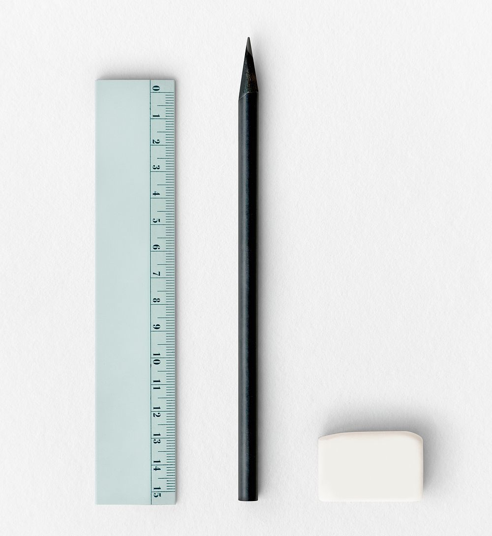 Ruler with a black pencil and a white eraser flatlay