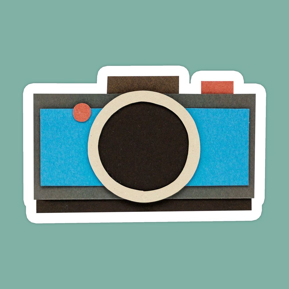 Blue analog camera paper craft sticker on green background