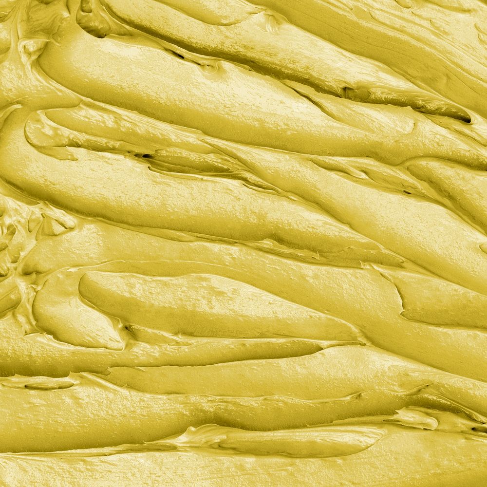 Yellow frosting texture background close-up
