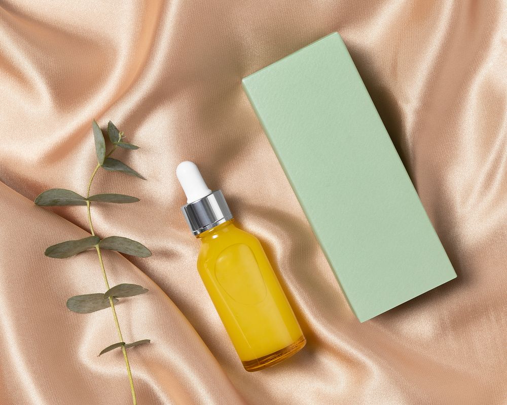 Skincare bottle, yellow dropper and green box, beauty product packaging design, business branding