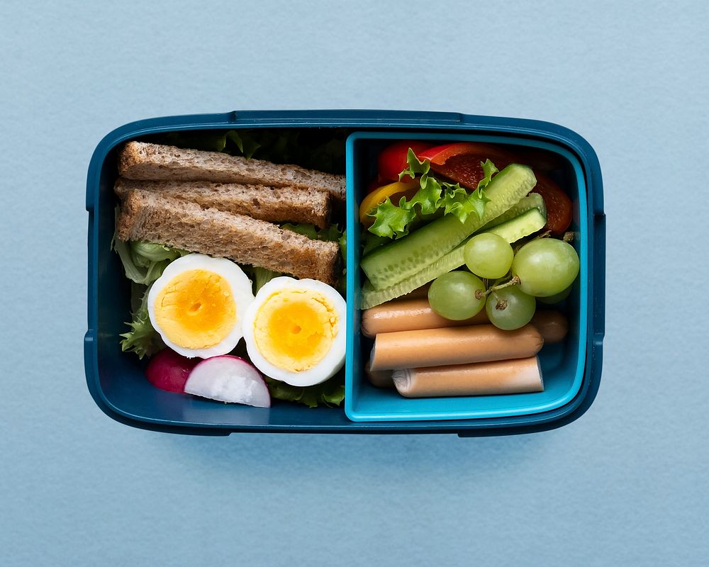 Healthy kids food lunchbox psd, with egg and greens