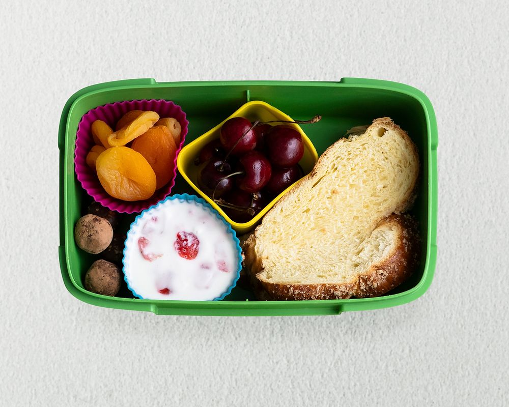 Kids healthy food lunchbox psd, with challah bread and dried fruits