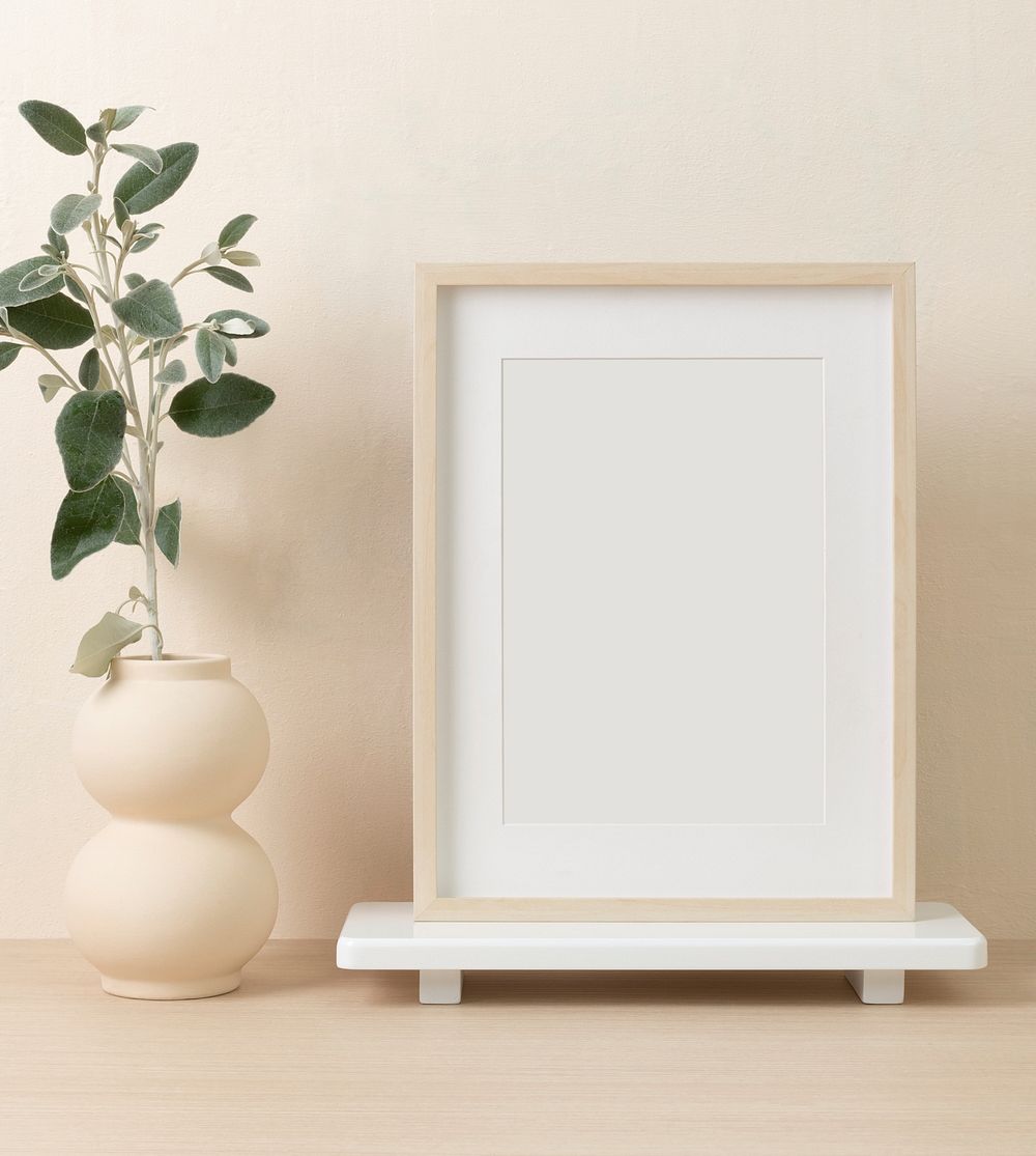 Empty picture frame, clean beige home interior decor