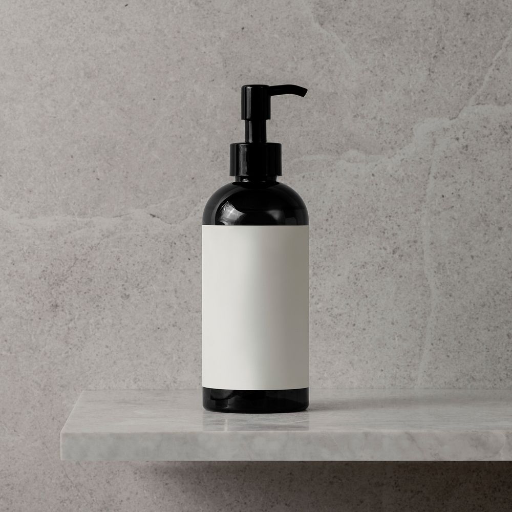 Brown dispenser bottle, blank white label, skincare product packaging, bathroom shelf