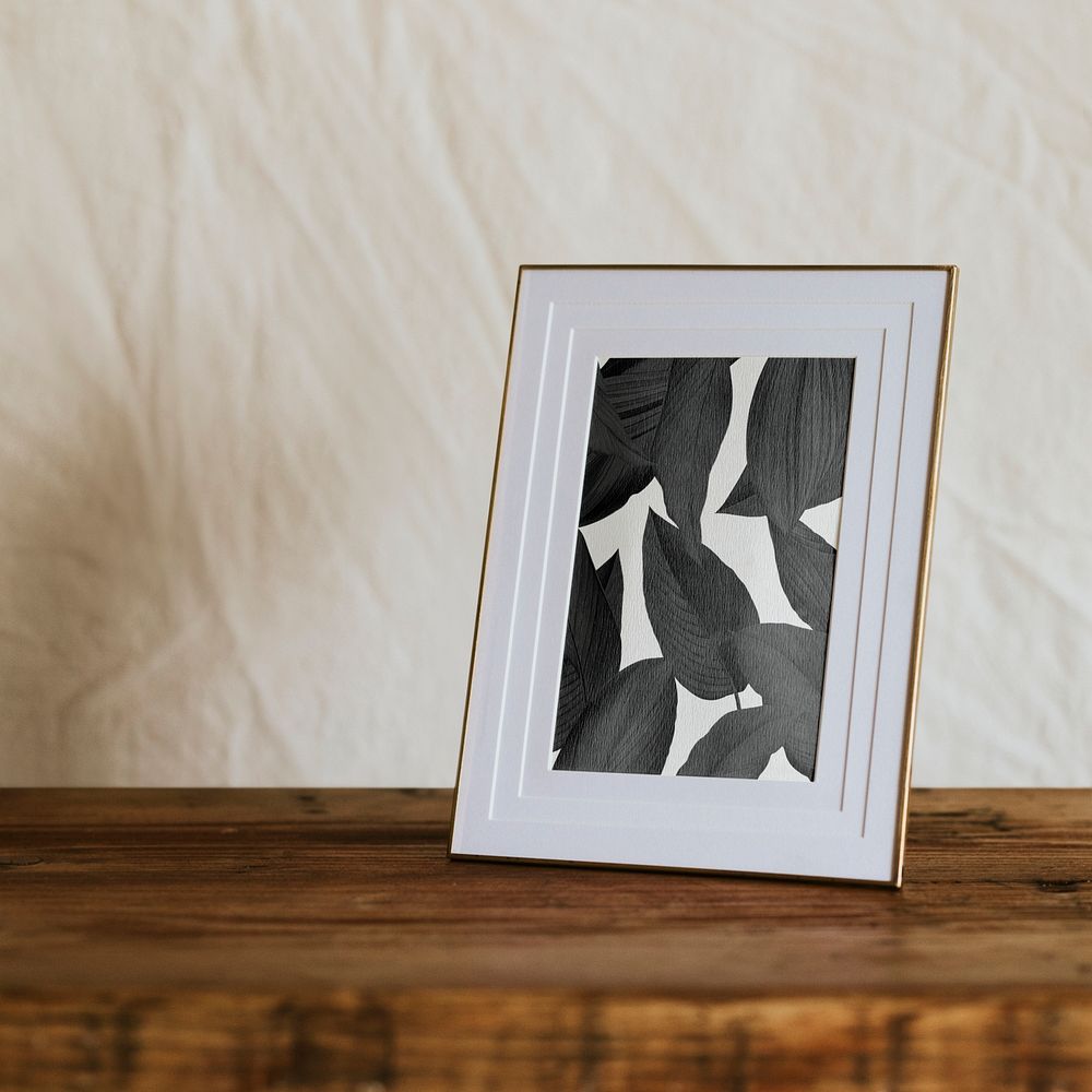 Aesthetic picture frame mockup psd, on wooden shelf, home decor