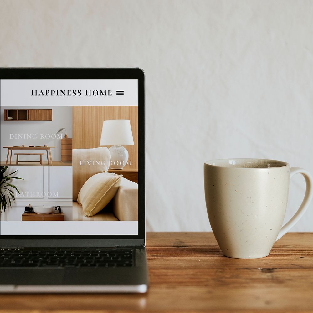 Laptop screen mockup psd with mug on kitchen table