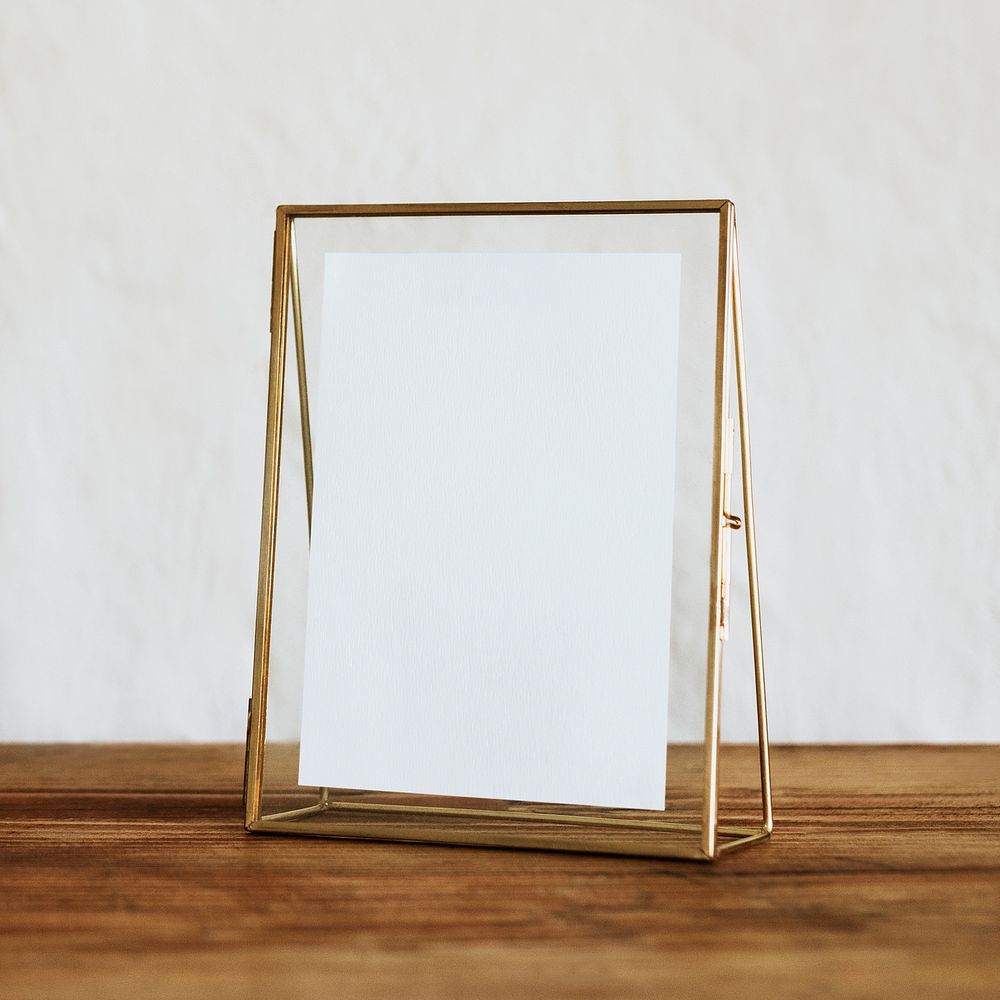 Aesthetic empty gold frame on shelf, home decor