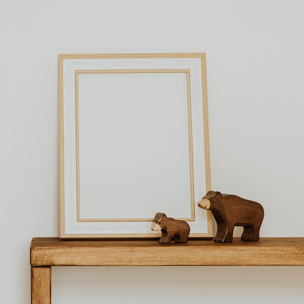 Empty wooden frame, aesthetic kids playroom, home decor