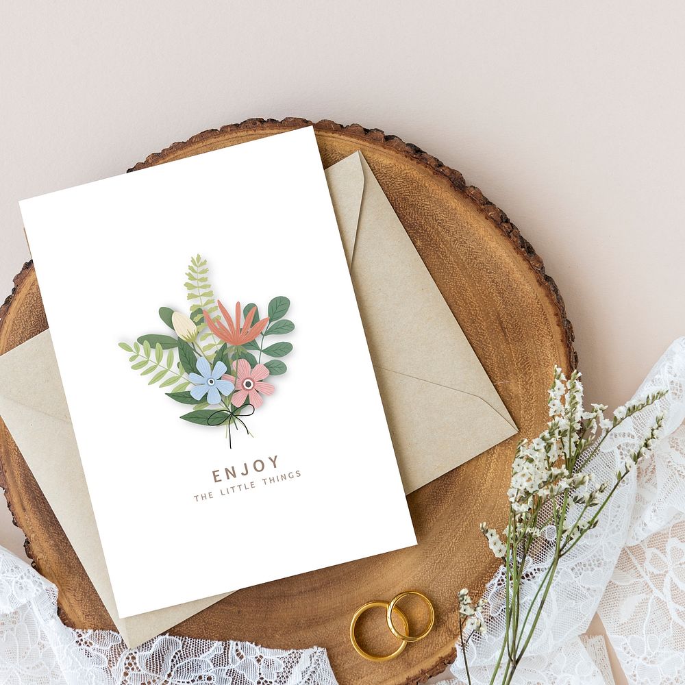 Blank floral card template mockup on a wooden plate
