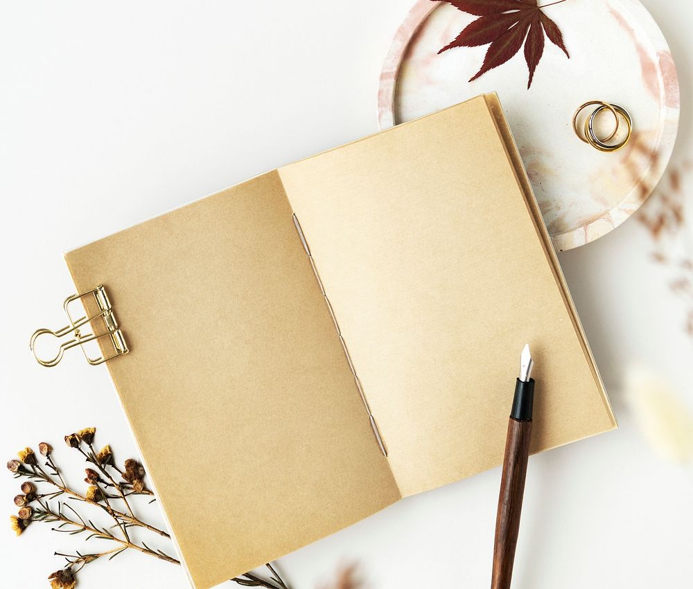 Old grunge notebook mockup with dried plant