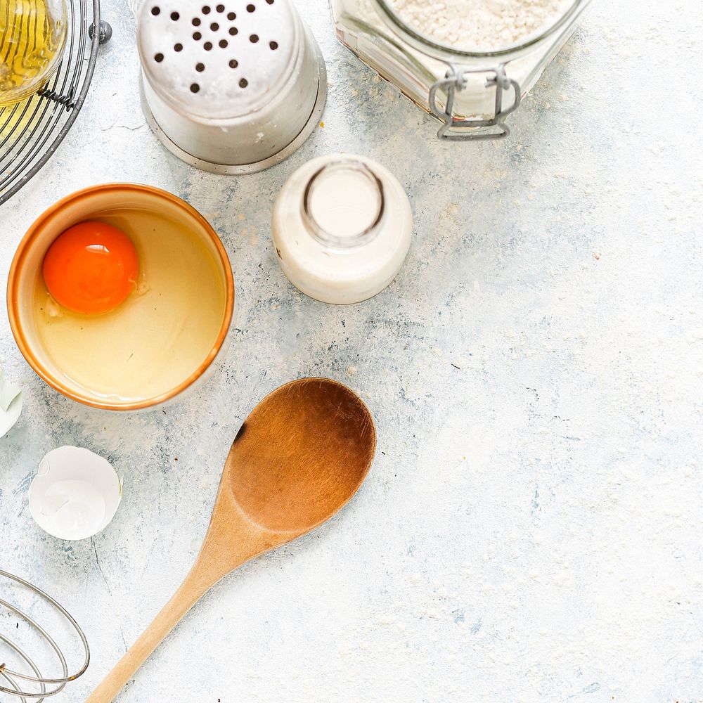 Baking utensils and ingredients on a white background