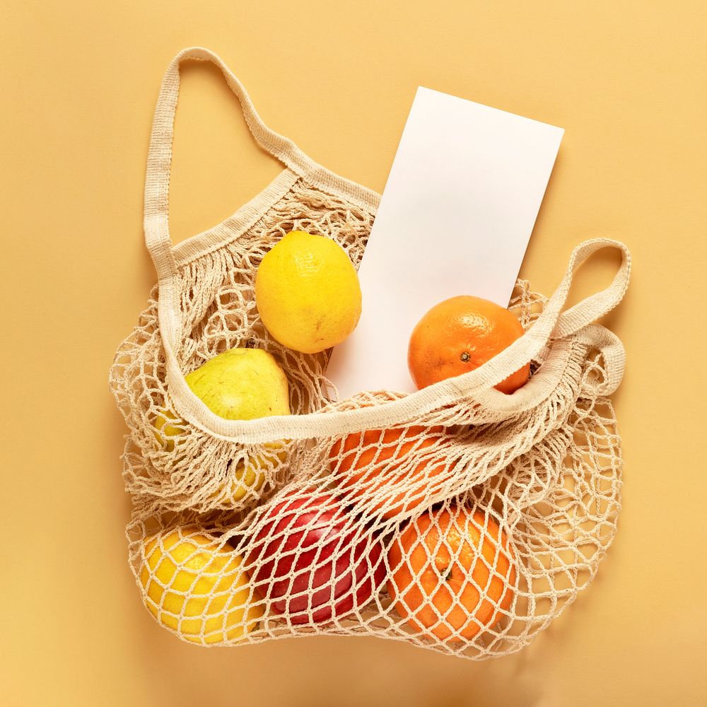 Flyer in a reusable net bag with fruits