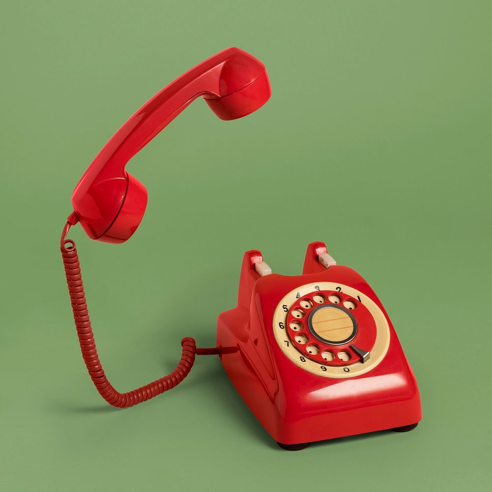 Red retro rotary phone mockup on a sage green background