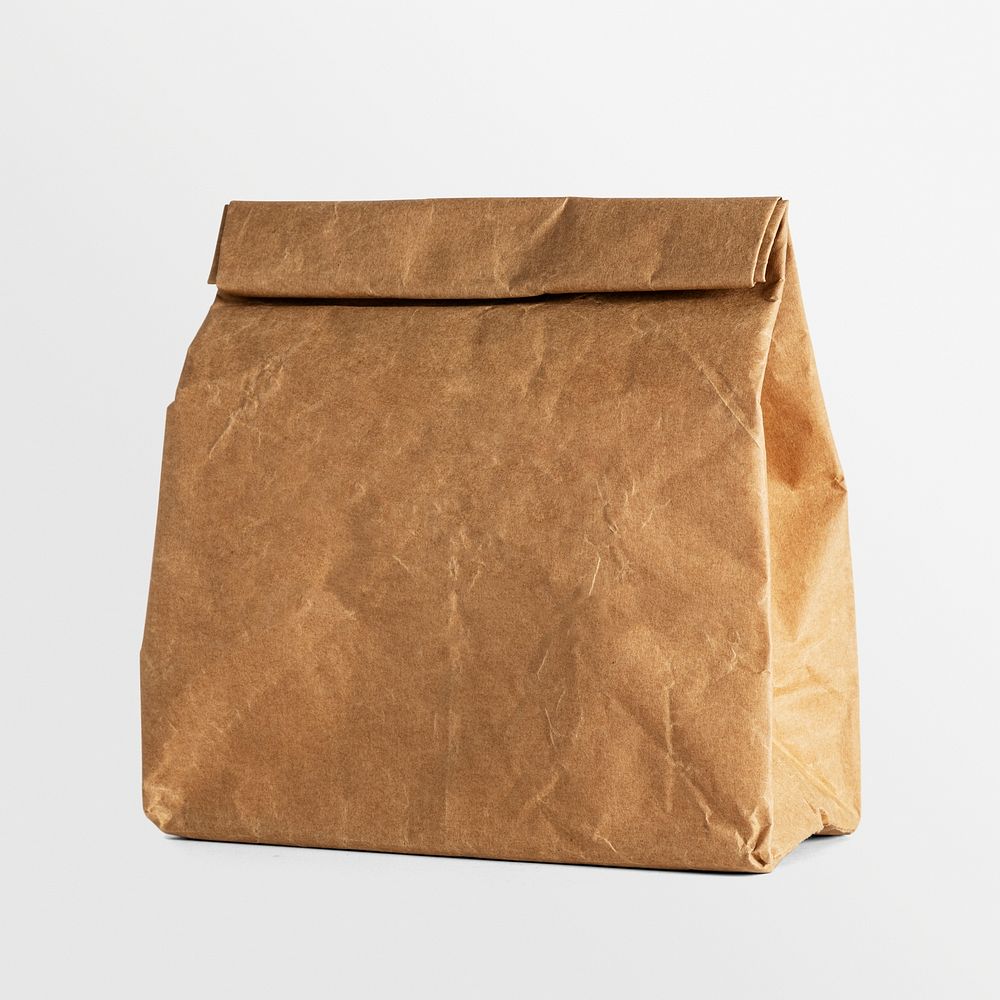 Rolled brown paper bag with copy space 