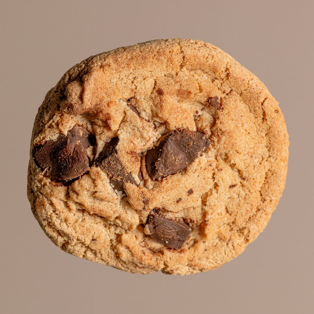 Single chocolate chip cookie mockup isolated on a light brown background
