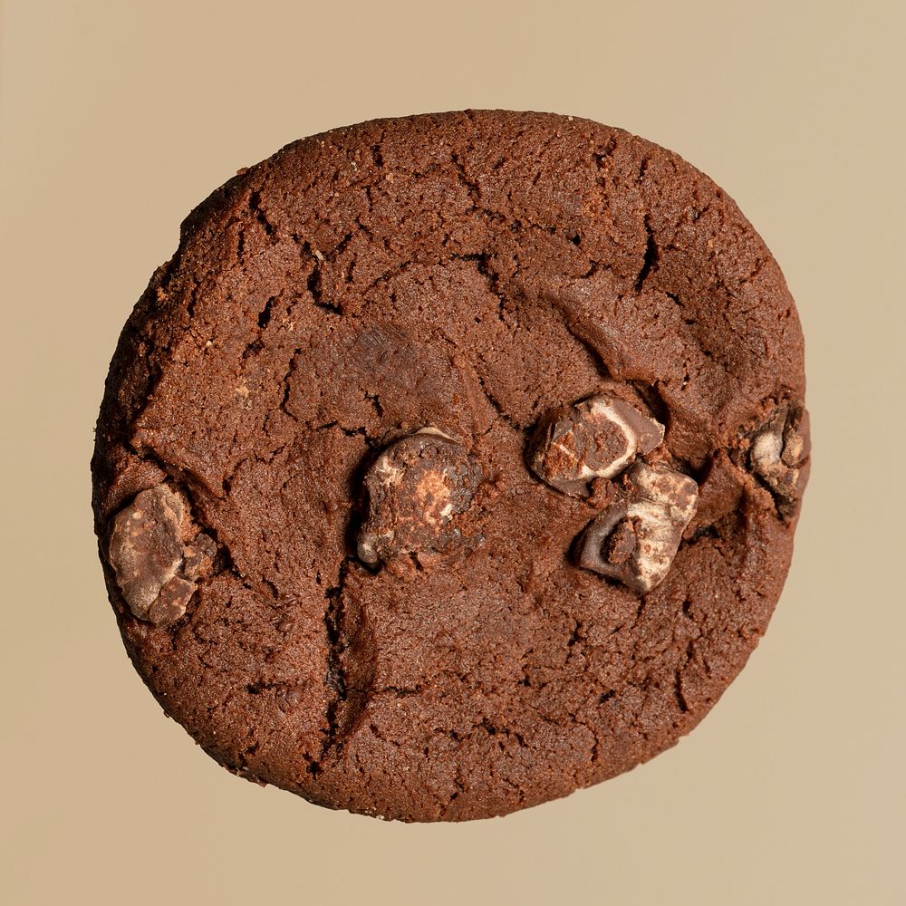 Single double chocolate chip cookie mockup isolated on a light brown background