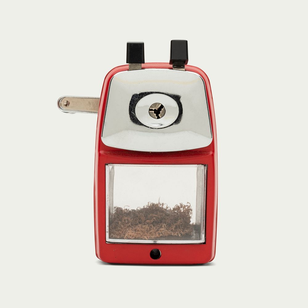 Red pencil sharpener on off white background
