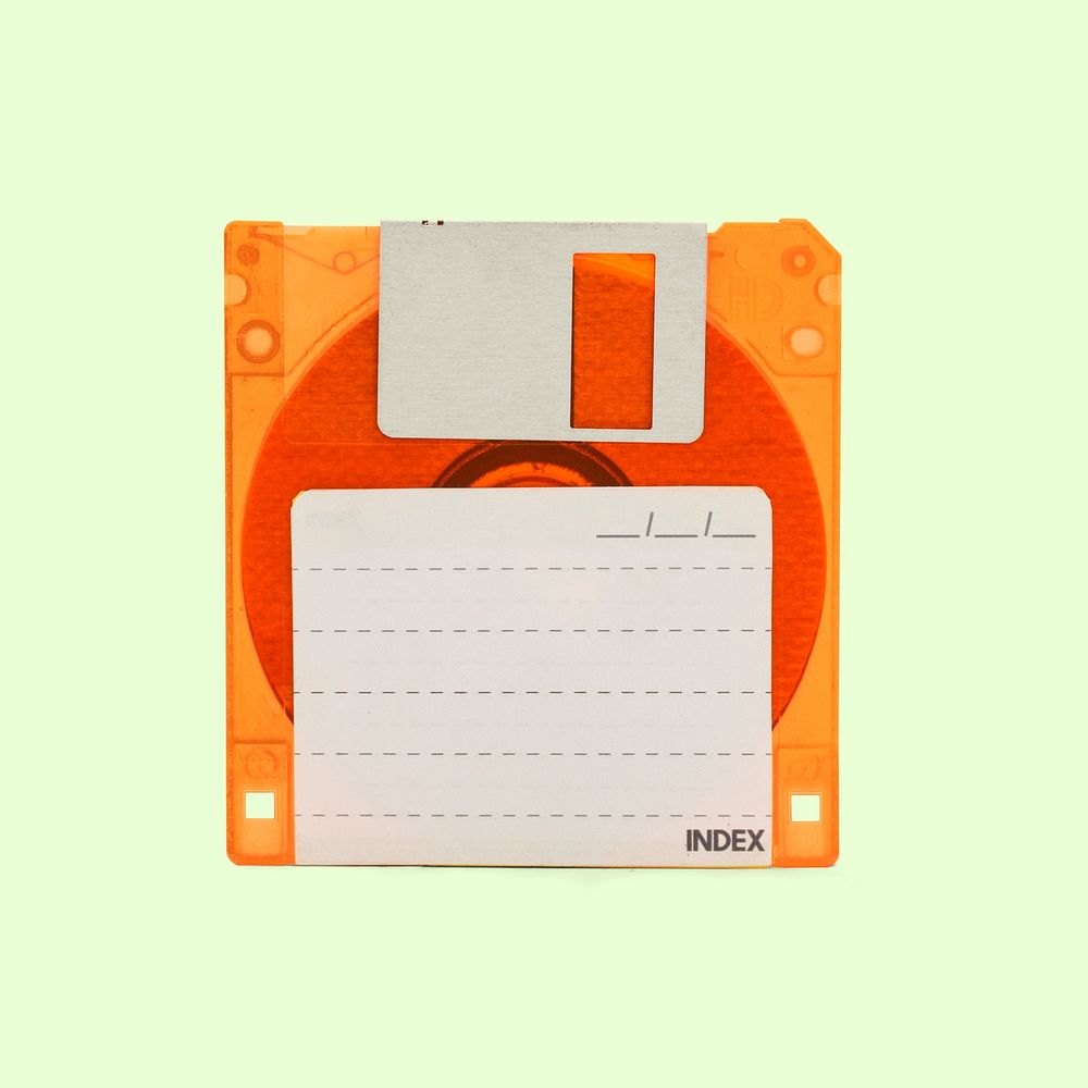 Orange floppy disk mockup on a light mint green background 