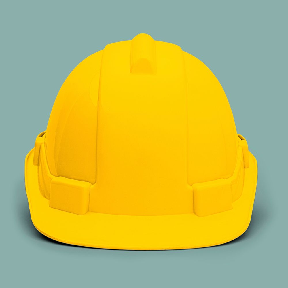 Yellow hard hat on green background
