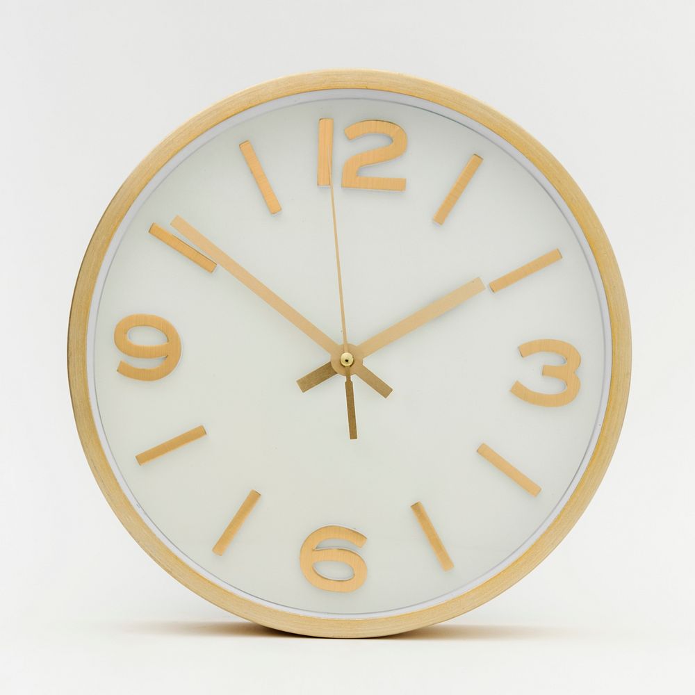 Round gold analog clock on a white background