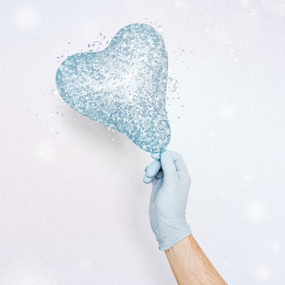 Gloved hand holding a glittery blue heart shaped balloon mockup