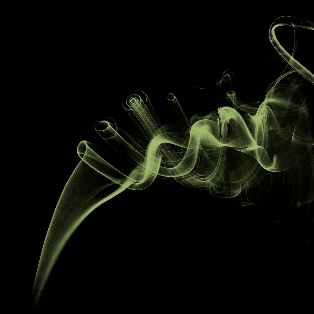 Green smoke effect design element on a black background
