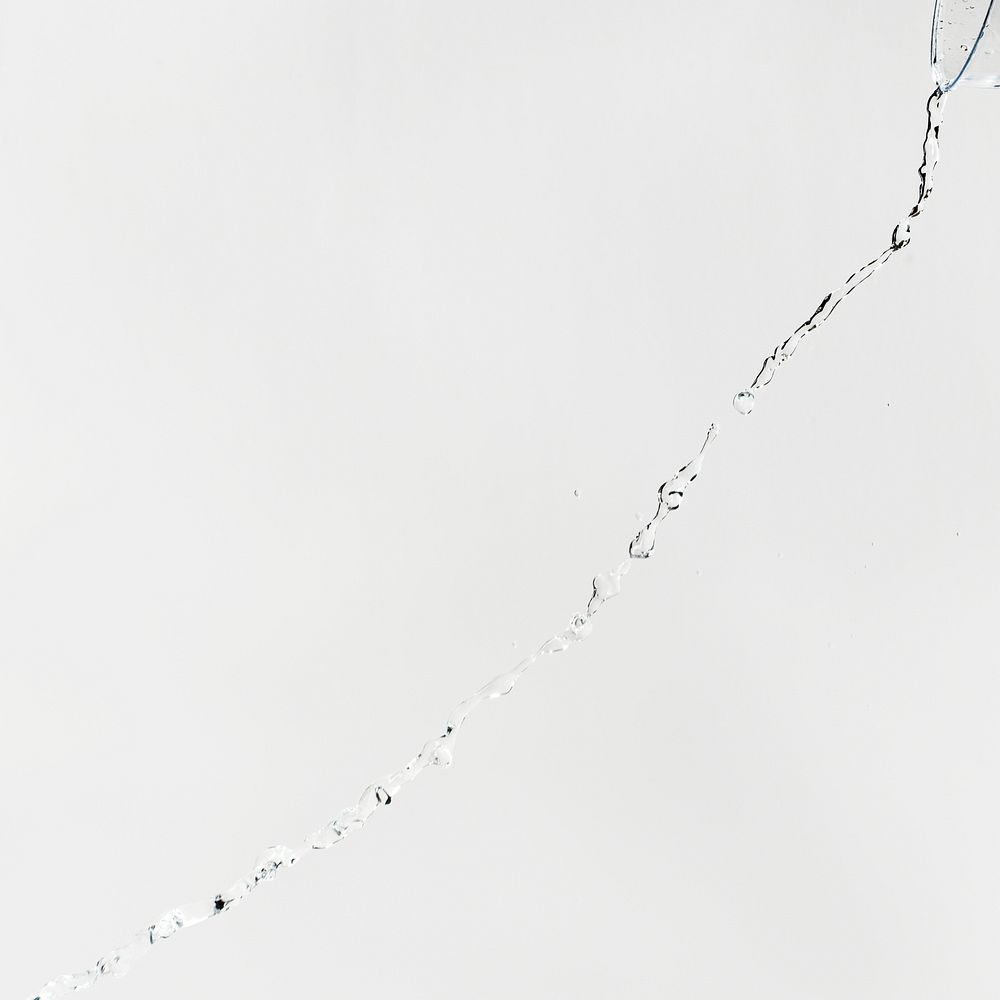 Water splash with drops on a gray background