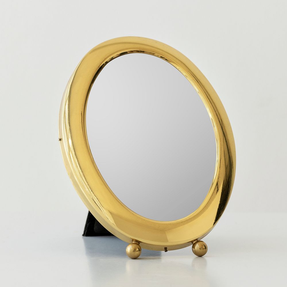 Round gold frame mirror design element
