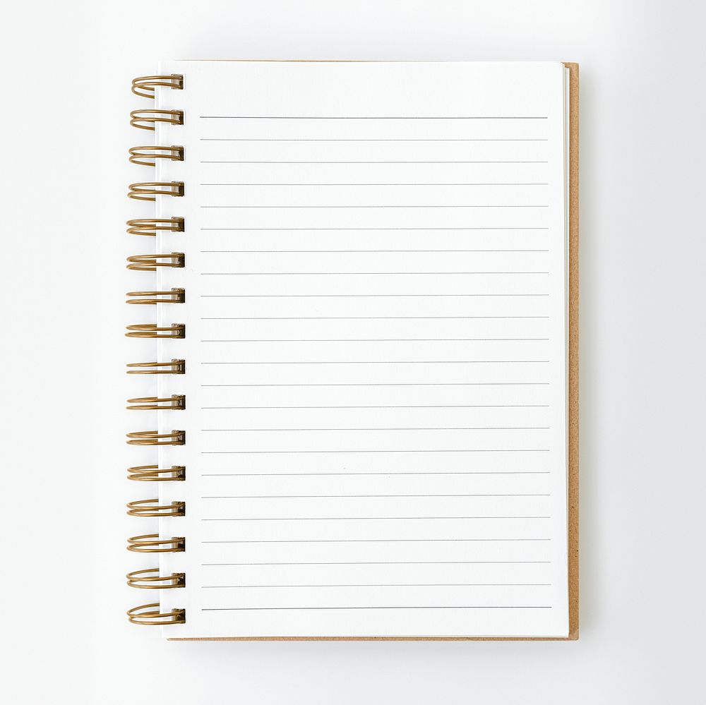 Blank ruled notebook mockup on a white table
