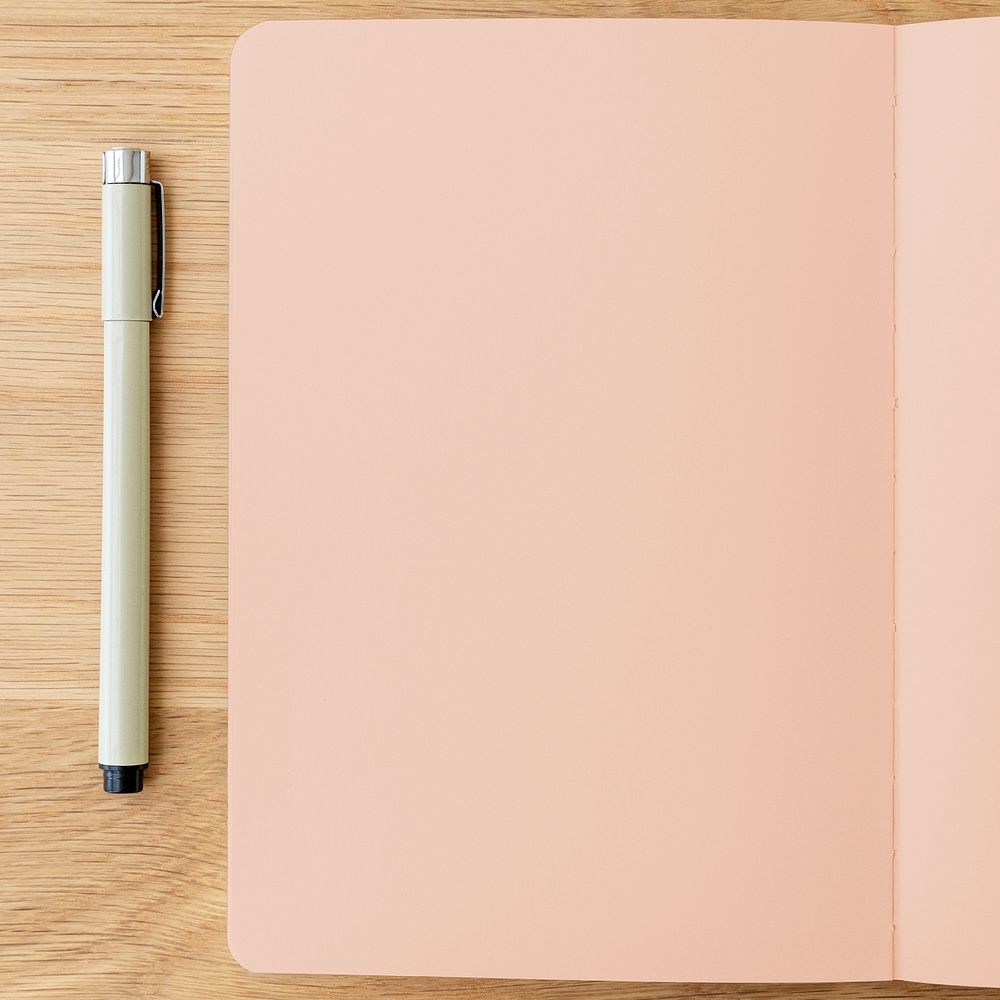 Blank plain pink notebook page with a pen mockup