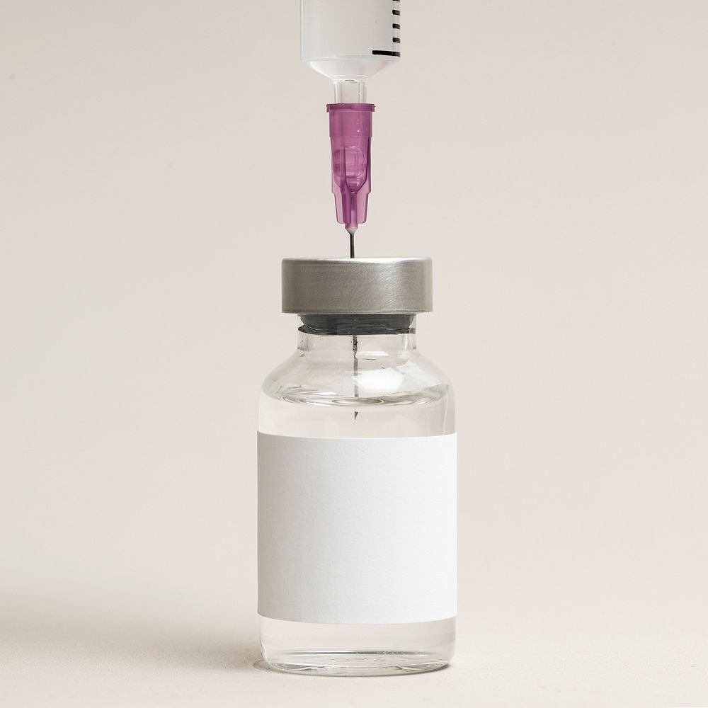 Blank white label on injection bottle glass vial with syringe