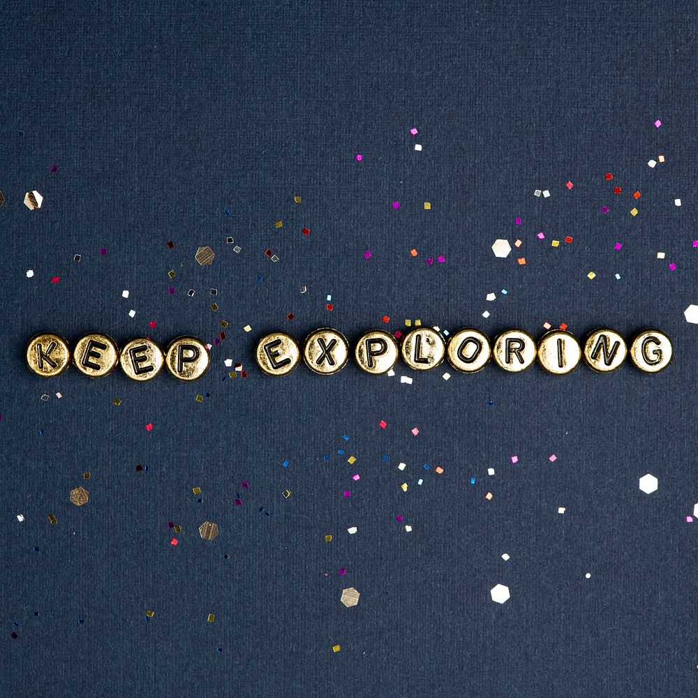 KEEP EXPLORING beads text typography on blue