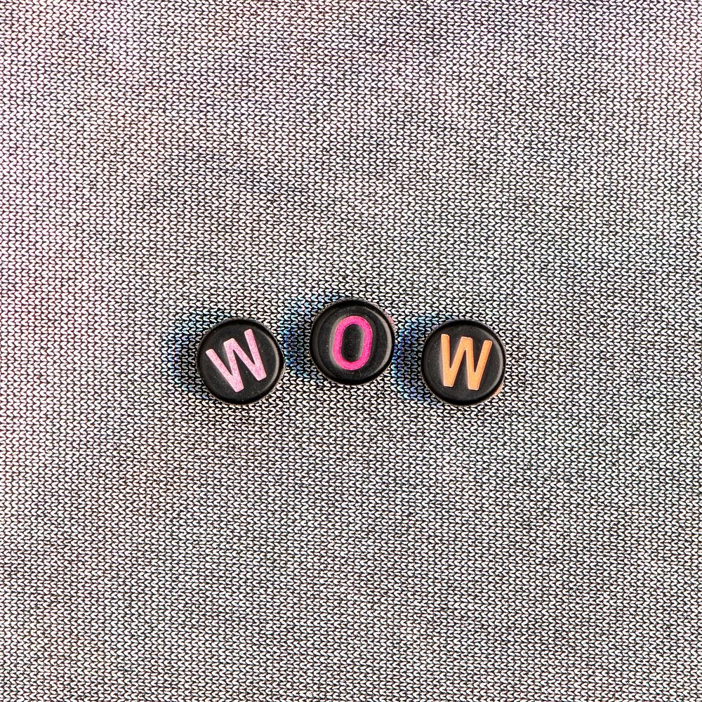 WOW beads text typography on gray
