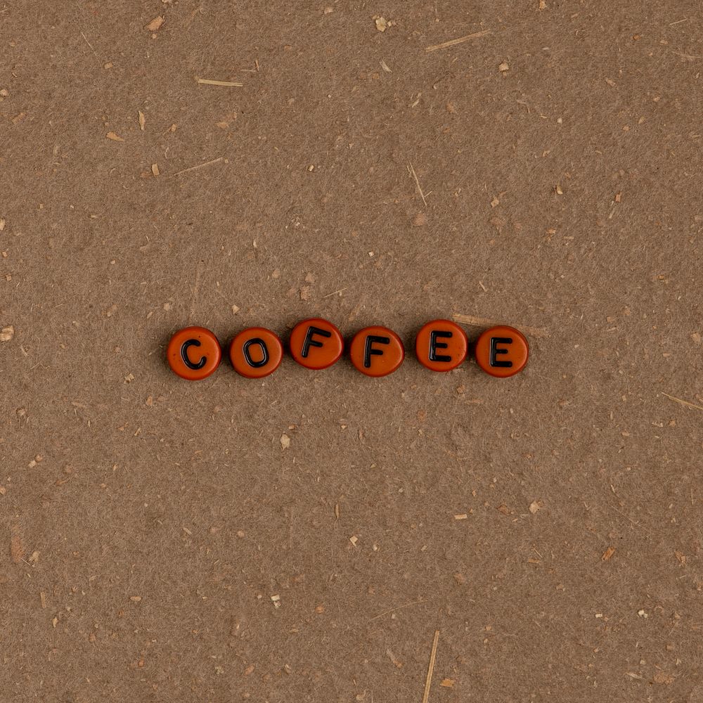 COFFEE beads text typography on brown
