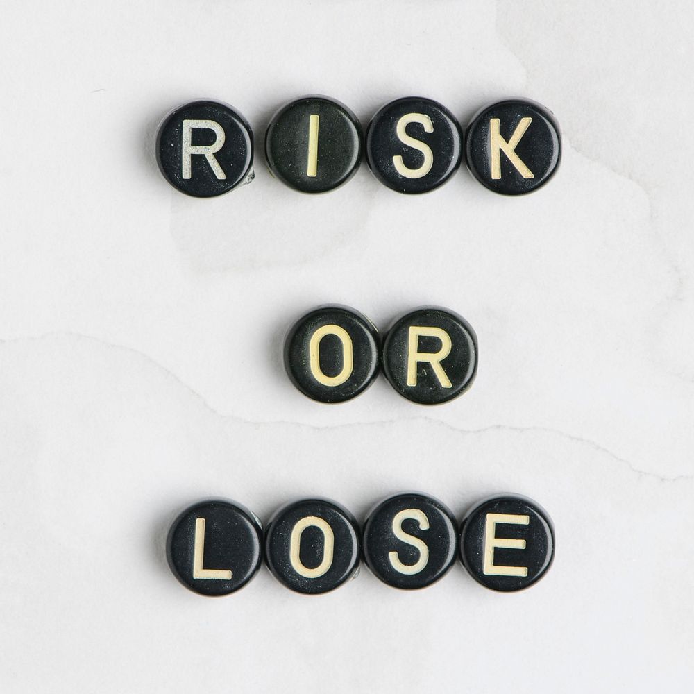 RISK OR LOSE beads message typography