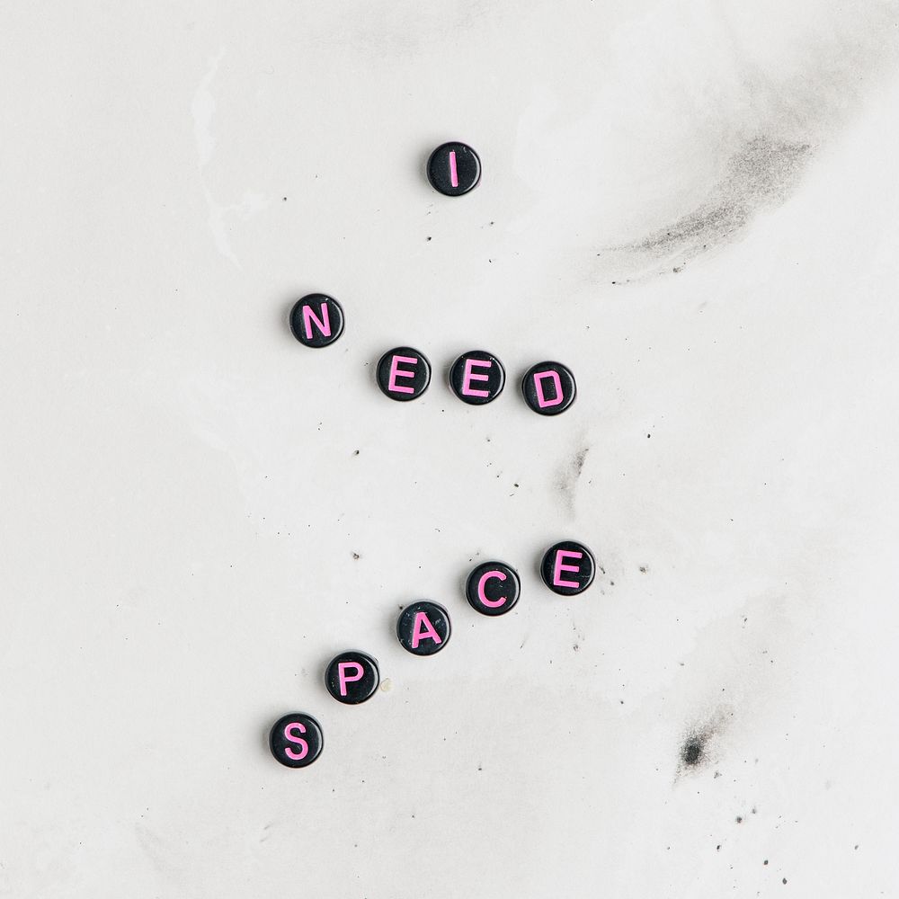 Black I NEED SPACE beads text typography on marble