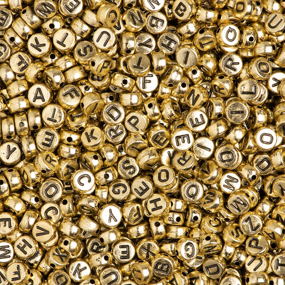 Gold English alphabet beads background