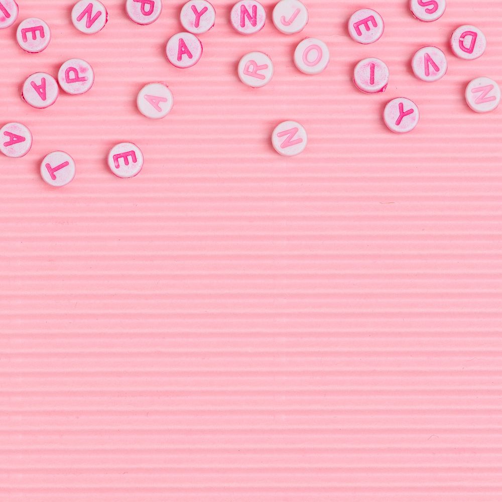 Alphabet beads border pink wallpaper background