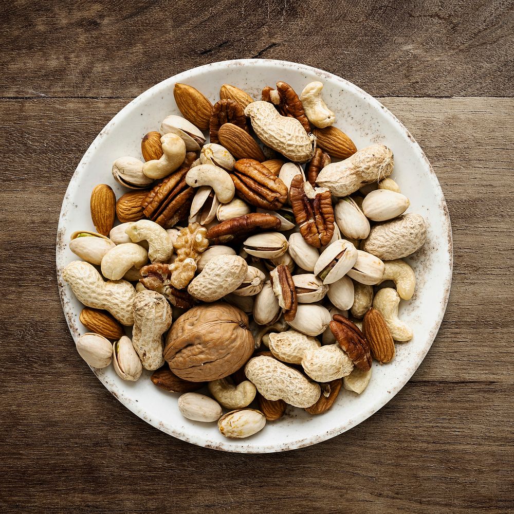 Mixed nuts psd in a bowl flat lay