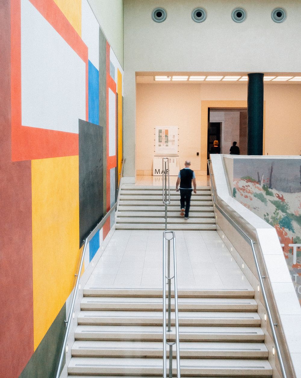 Stairs by an artistically painted wall