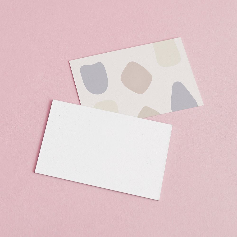 Business cards on pink background