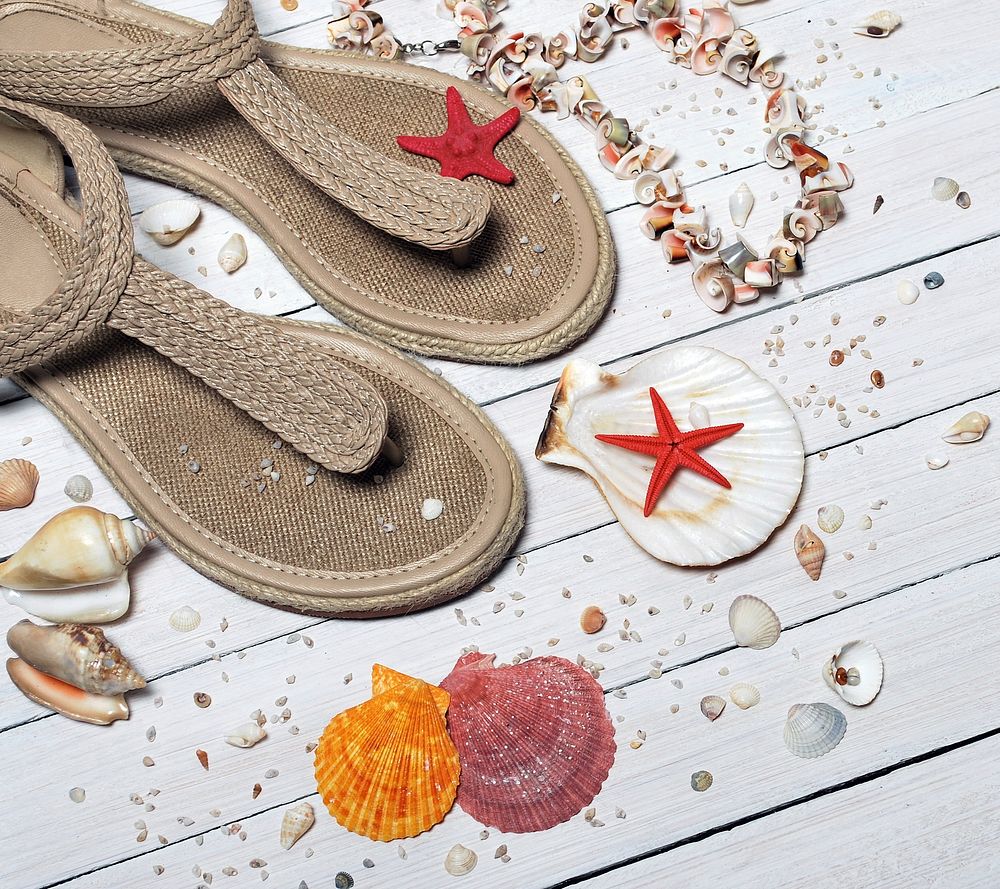 Beach sandal, vacation, seashells, wooden background, free public domain CC0 photo.