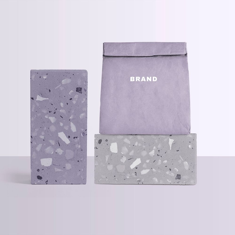 Reusable paper bag mockup psd rolled up in terrazzo pattern