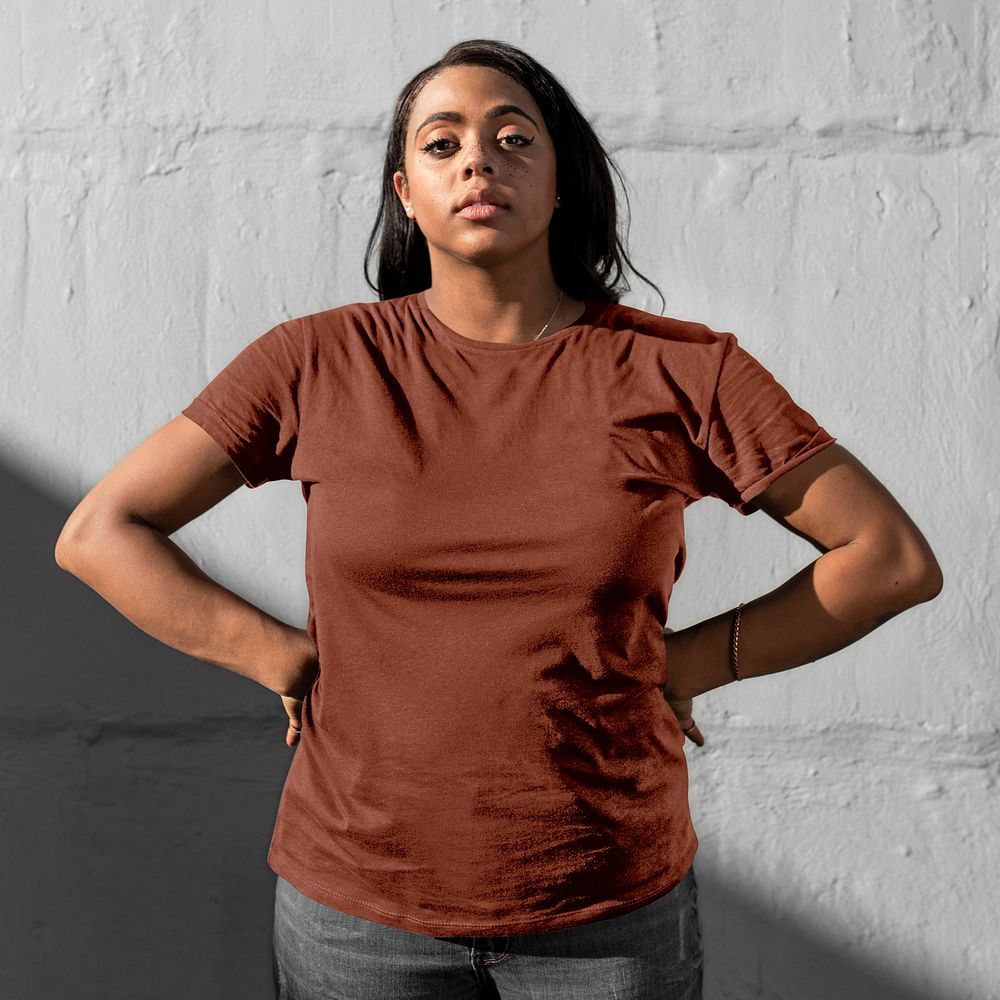 Casual tshirt mockup, simple brown apparel design worn by a young woman psd