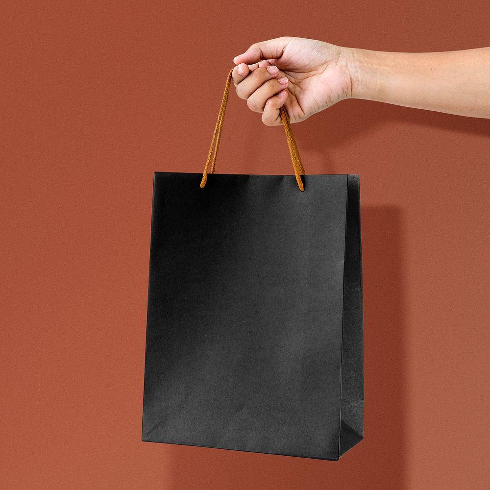 Black shopping bag, business branding with blank design space